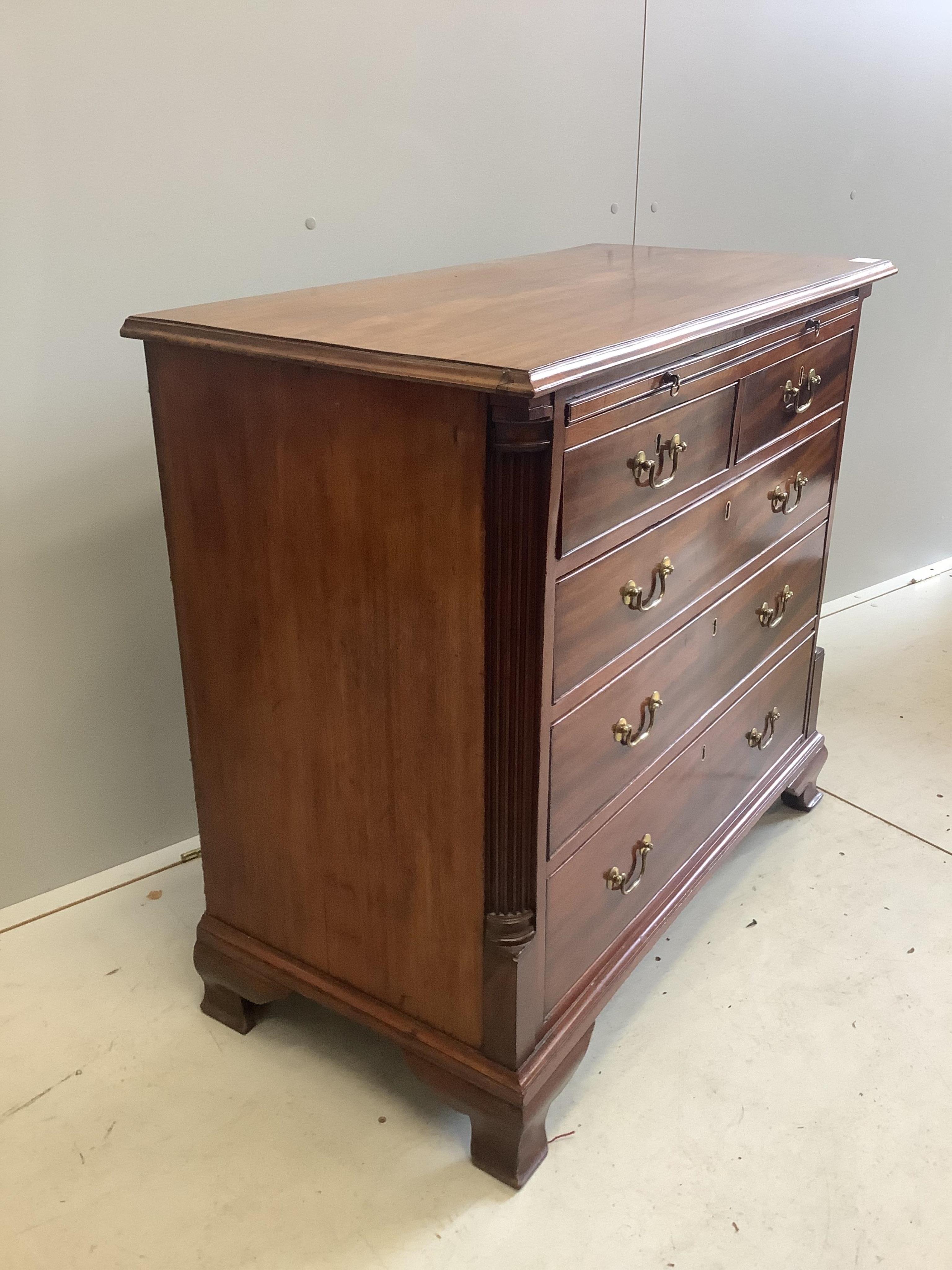 A George III mahogany chest of drawers with brushing slide, width 33cm, depth 47cm, height 85cm. Condition - good